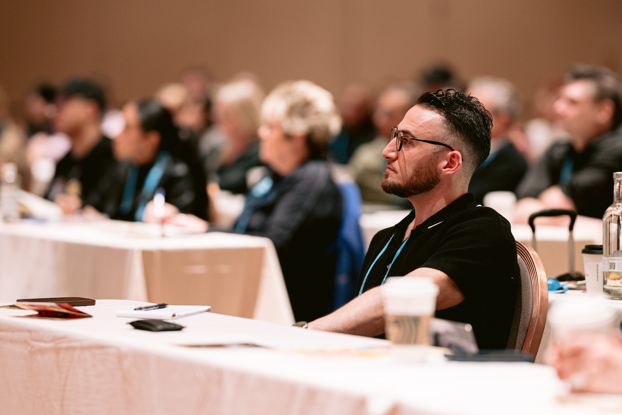 Attendee listening during a summit session